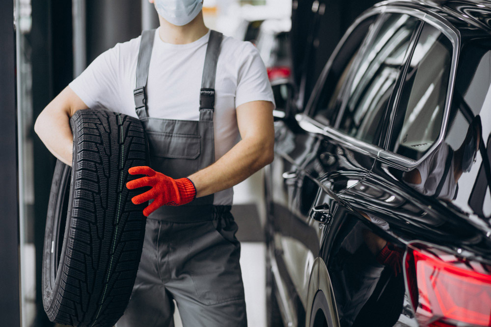 Mechanic changing tires car service